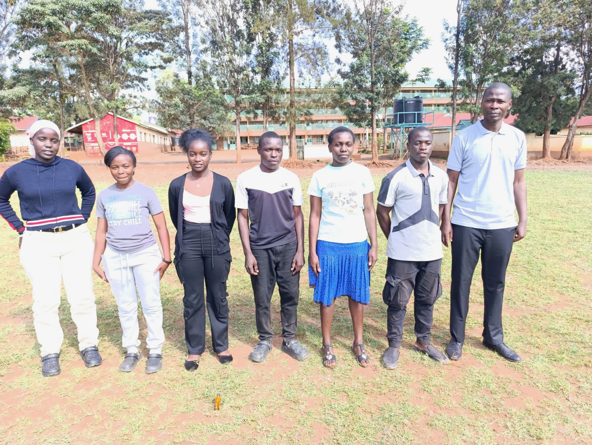 A group of Soma Initiative students with their programme coordinator outside their school